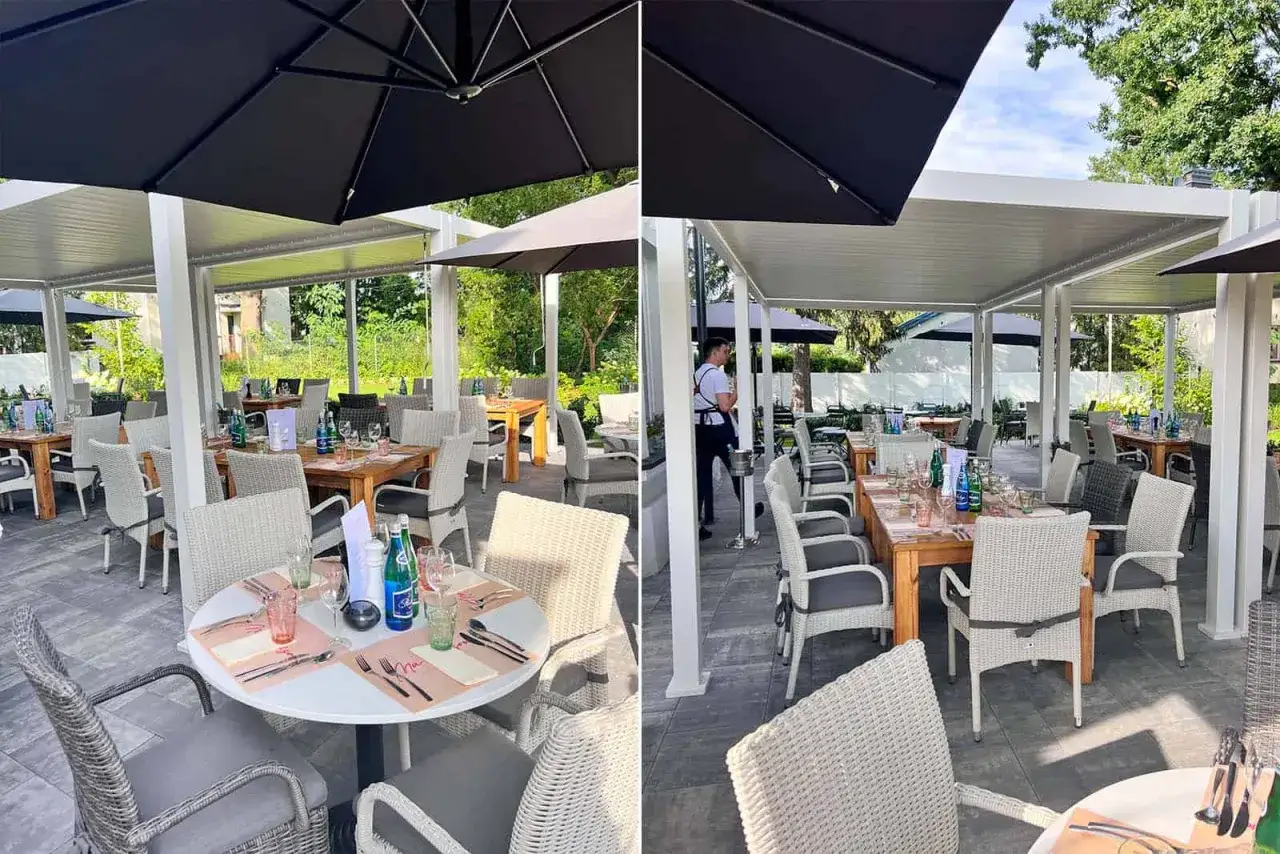 Elegancki ogród restauracyjny, gdzie Michel Moran mógłby delektować się posiłkiem. Stoły nakryte, czekają goście.